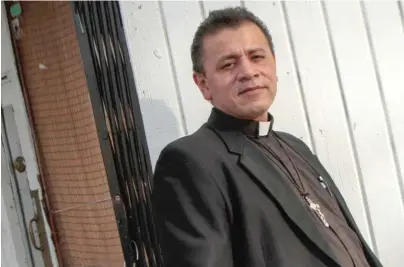  ??  ?? The Rev. Jose Landaverde, who escaped from El Salvador, says his story mirrors that of many immigrants. | LESLIE ADKINS/ FOR THE SUN- TIMES