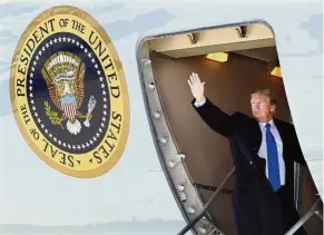  ??  ?? Duty calls: Trump waving good-bye while boarding Air Force One for his trip to Vietnam in Andrews Air Force Base, Maryland. — AP