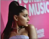  ?? ANGELA WEISS — AFP /GETTY IMAGES ?? Ariana Grande’s fix on her tattoo didn’t seem to fix anything.