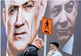  ?? ODED BALILTY/AP ?? Before elections March 2, a billboard showed Benny Gantz, left, and Prime Minister Benjamin Netanyahu.