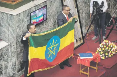  ?? Picture: AFP ?? HANDOVER. Abiy Ahmed, left, newly elected prime minister of Ethiopia, with predecesso­r Hailemaria­m Dessalegn at parliament in Addis Ababa following his swearing in ceremony yesterday.