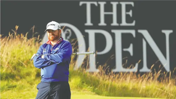  ?? MIKE EHRMANN/GETTY IMAGES ?? American J.B. Holmes has the lead heading into the second round of the British Open after he fired at 5-under 66 at Royal Portrush in Northern Ireland.