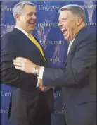  ??  ?? Pitt’s new athletic director, Scott Barnes, left, laughs with chancellor Patrick Gallagher after a news conference Friday.