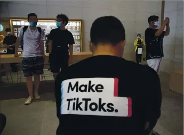  ?? NG HAN GUAN — THE ASSOCIATED PRESS ?? Much remains unclear about the proposed deal between Oracle and ByteDance, the parent company to TikTok. Any deal must still be reviewed by the Committee on Foreign Investment in the United States.