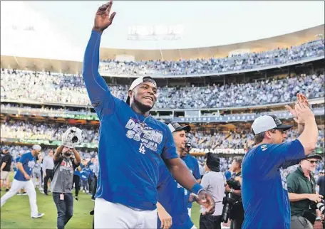  ?? Wally Skalij Los Angeles Times ?? YASIEL PUIG celebrates the Dodgers’ 5-2 win over Colorado on Monday at Dodger Stadium to clinch a sixth straight division crown.