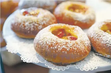  ?? PHOTOS BY GABRIELA CAMPOS/THE NEW MEXICAN ?? Madame Matisse’s brioche with strawberri­es, one of the pastries made daily at the new cafe at 1291 San Felipe Ave. The restaurant opened in April, and there are plans to open a downtown grab-and-go location.