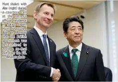  ??  ?? Hunt shakes with Abe (right) during a courtesy call at the latter’s official residence in Tokyo, Japan. Hunt reassured Abe on Monday that the British government was determined to avoid a no- deal exit from the EU. — Reuters photo