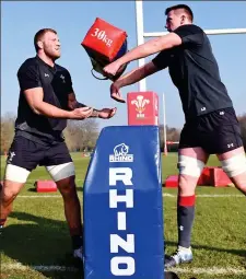  ??  ?? Pass it on: Ross Moriarty and Adam Beard in training