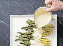  ?? DANIEL J. VAN ACKERE AMERICA’S TEST KITCHEN VIA AP ?? Roasting asparagus deepens its flavour.
