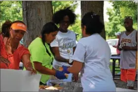  ?? MARIAN DENNIS — DIGITAL FIRST MEDIA ?? Several donors provided food to attendees at the ninth Stop the Drugs Stop the Violence event on Saturday in Pottstown. Guests were able to enjoy music and have open discussion­s about the drugs and violence problem in Pottstown.