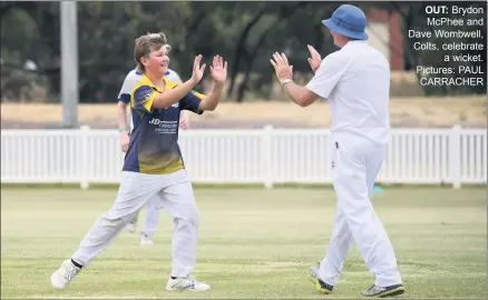  ?? ?? OUT: Brydon Mcphee and Dave Wombwell, Colts, celebrate a wicket. Pictures: PAUL CARRACHER