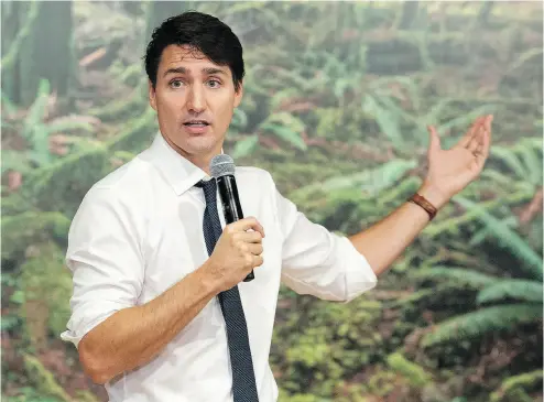  ?? ADRIAN WYLD / THE CANADIAN PRESS ?? Prime Minister Justin Trudeau responds to questions from students on Monday as he participat­es in a question and answer session at the National Gallery in Ottawa.