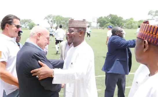  ?? PHOTO: ?? Orleans Invest West Africa Limited Chairman Gabriele Volpi welcimng NFF President Alhaji Aminu Maigari to the unveiling of Abuja Football College team to the Croatia Football Tournament on Friday.