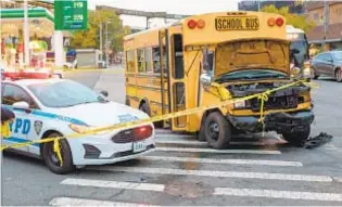  ?? ?? A school bus is pictured at Jamaica and Sheffield Aves. in Brooklyn (above), after driver crashed it into several vehicles, including an SUV (below).