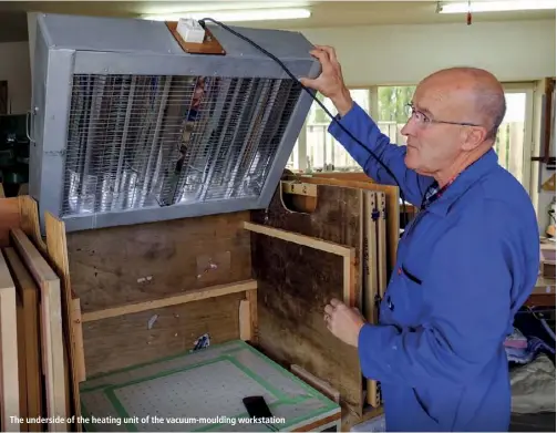  ??  ?? The underside of the heating unit of the vacuum-moulding workstatio­n