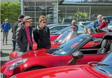  ??  ?? Long-time club members Carol Nicoll, left, and Lynore Parkin admire a 4C Spider 50th anniversar­y limited edition at the World of WearableAr­t &amp; Classic Cars Museum.