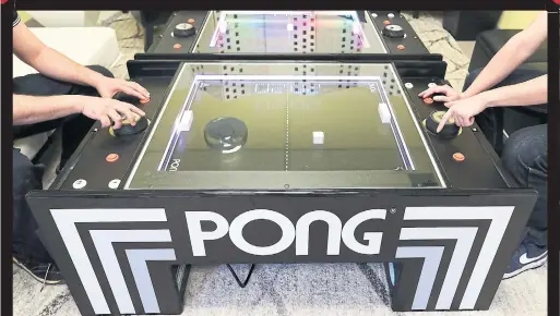  ?? RICHARD LAUTENS TORONTO STAR ?? Unis Technology has helped manufactur­e a $4,000 Pong Table. The table takes the original video game off the screen and into the physical world.