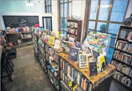  ??  ?? Supporting African writers: Bridge Books in central Johannesbu­rg. Photo: Anthony Schultz