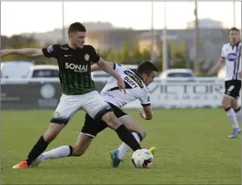  ??  ?? Bray’s Ryan Brennan battles with Michael Duffy at the Carlisle Grounds.