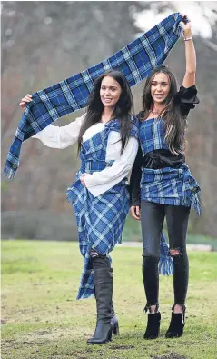  ?? Picture: PA. ?? Louisa Thomson, left, and her twin sister Christina model the new tartan.