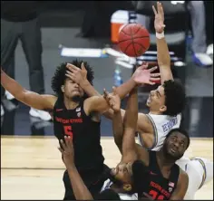  ?? Associated Press ?? BATTLING Oregon State’s Ethan Thompson, clockwise from top left, UCLA’s Jules Bernard, Oregon State’s Rodrigue Andela, and UCLA’s Cody Riley (2) vie for a rebound in the quarterfin­al round of the Pac-12 men’s tournament on Thursday in Las Vegas. Oregon St. won 83-79 in overtime.