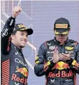  ?? ?? MEXICAN Formula One driver Sergio Perez, left, of Red Bull Racing, celebrates on the podium next to teammate, Dutch driver Max Verstappen, after he won the Azerbaijan Grand Prix. | ALI HAIDER EPA