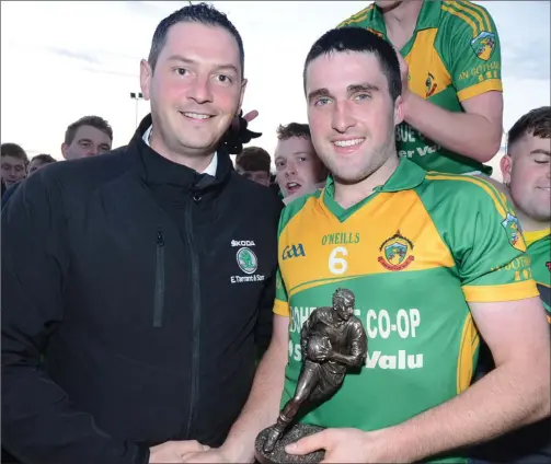  ??  ?? Boherbue’s Niall Murphy receives the Duhallow JAFC Final Man of the Match Award from Connie Tarrant. Photo by John Tarrant