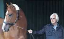  ?? PHOTO: REUTERS ?? Greatness beckons . . . Justify and trainer Bob Baffert.