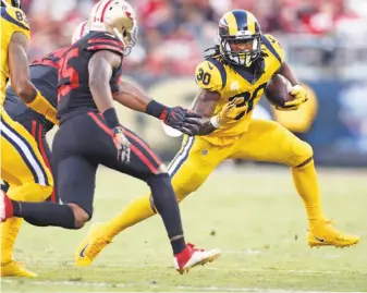  ?? Scott Strazzante / The Chronicle ?? L.A. running back Todd Gurley gashes the 49ers’ defense in the first quarter. He ran for 113 yards on 28 carries. Gurley also had five receptions for 36 yards.