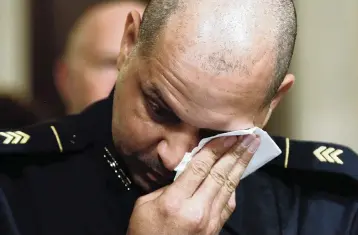  ?? JIM BOURG Pool photo via AP ?? U.S. Capitol Police Sgt. Aquilino Gonell wipes his eye during a House select committee hearing Tuesday about the Jan. 6 attack on Capitol Hill in Washington.