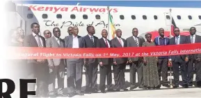  ??  ?? Transport and Infrastruc­tural Developmen­t Minister Dr Joram Gumbo (fifth from right) is joined by other dignitarie­s after the landing of a Kenya Airways plane in Victoria Falls yesterday