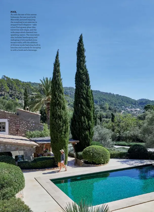  ??  ?? POOL
As with the rest of this serene hideaway, the new pool (with Mercedes pictured enjoying the sunshine) is an exercise in stripped-back elegance – take a bow Portuguese glass tiles, travertine slab edges, and the wide steps which descend into sparkling waters. The renovation also included landscapin­g and reshaping of dry-packed stone terrace walls, with the addition of diverse nooks featuring built-in benches and sunbeds for escaping to with a book and a beverage.