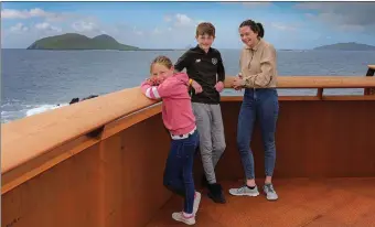  ?? Photo by Valerie O’Sullivan ?? What a view: Róisin, Ruairí and Sibéal Ó hÓgáin at the new Wild Atlantic Way Viewing point on the cliffs beside Ionad an Bhlascaoid in Dún Chaoin.