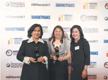  ??  ?? RECEIVING on behalf of Insular Life the awards for the Domestic Life Insurer of the Year — Philippine­s, and the Digital Insurance Initiative of the Year — Philippine­s are (L- R) CEO Nina D. Aguas, President and COO Mona Lisa B. de la Cruz, and SAVP and...