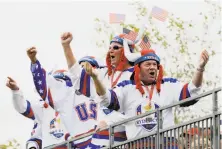  ?? David J. Phillip / Associated Press ?? Fans cheer during a practice round for the Ryder Cup Wednesday at Hazeltine National Golf Club in Chaska, Minn.