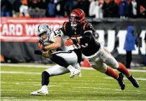  ?? AP ?? Linebacker Logan Wilson injured his shoulder in a Week 13 loss to the Chargers and was carted off the field, but he returned four weeks later to help the Bengals clinch the AFC North title.