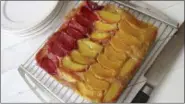  ?? SARA MOULTON VIA AP ?? This photo shows a stone fruit, almond upside down cake in New York. This dish is from a recipe by Sara Moulton.