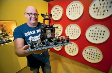  ?? PHOTO: DAVID UNWIN/ STUFF ?? Lego Minifig collector Al Collis at Te Manawa’s Brick Flicks exhibition with a set of figurines from ‘‘The Lego Ninjago Movie’’.