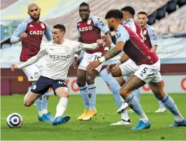  ?? — AP ?? Manchester City’s Phil Foden (second from left) scores against Aston Villa in an English Premier League match at Villa Park Stadium in Birmingham on Wednesday.