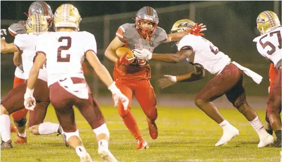  ?? DOUGLAS KILPATRICK/ SPECIALTOT­HE MORNING CALL ?? Parkland’s Isiah Rico finds room against Whitehall during the Trojans’ season opener Friday at Orefield Middle School.