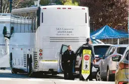  ?? STEVE HELBER/AP ?? Police investigat­ors work near a charter bus Monday that is believed to be the site of a deadly shooting late Sunday at the University of Virginia in Charlottes­ville.