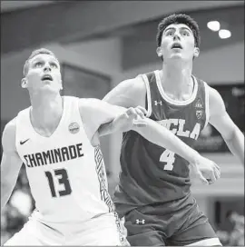  ?? Darryl Oumi Getty Images ?? UCLA FRESHMAN GUARD Jaime Jaquez Jr. battles Chaminade’s Tyler Cartaino for position. Jaquez finished with 17 points, 12 rebounds and three steals.