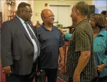  ?? RICK KAUFFMAN — DIGITAL FIRST MEDIA ?? Rev. Dr. Horace Strand of the Faith Temple Holy Church in Chester talked with members of the Chester community who have taken issue with the dismissal of Chester basketball coach Larry Yarbray.