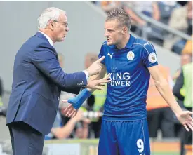  ??  ?? Leicester City manager Claudio Ranieri, left, talks to striker Jamie Vardy.