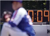  ?? JOHN MINCHILLO — THE ASSOCIATED PRESS, FILE ?? A pitch clock is deployed to restrict pitcher preparatio­n times during a minor league game between the Brooklyn Cyclones and Greensboro Grasshoppe­rs on July 13.