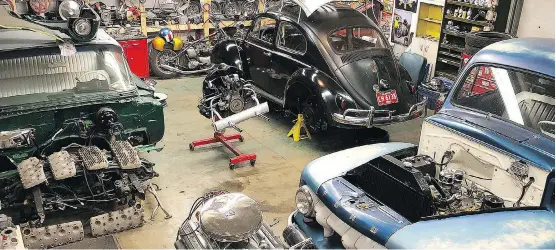  ?? PHOTOS: BRETT PATTERSON ?? Pro auto-body painter Brett Patterson’s busy garage includes a 1960 Bel Air in pieces, a 1960 VW Beetle waiting for it’s ragtop roof and a 1951 Ford truck.