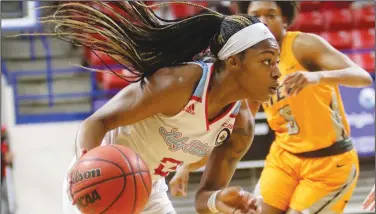  ?? Darrell James/Louisiana Tech Sports Informatio­n ?? On the move: Louisiana Tech’s Keiunna Walker makes her way to the basket during a game earlier this season. The Lady Techsters finish the regular season this weekend with a series at Rice.