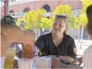  ?? KARL MERTON FERRON/BALTIMORE SUN ?? Cassie Yates and four friends gather Wednesday at Pickles Pub across from Oriole Park at Camden Yards for the team’s 2020 home opener.