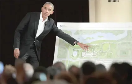  ?? | SCOTT OLSON/ GETTY IMAGES ?? Former President Barack Obama points out features of the proposed Obama Presidenti­al Center, which is scheduled to be built in Jackson Park, during a gathering at the South Shore Cultural Center last May.