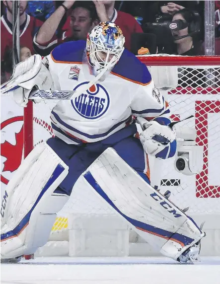  ?? MINAS PANAGIOTAK­IS/GETTY IMAGES ?? Edmonton goaltender Cam Talbot celebrates after making a save in the shootout during Sunday’s 1-0 victory over the Montreal Canadiens at the Bell Centre. The dramatic victory snapped a three-game slide for the Oilers, who head into the bye-week break feeling good about themselves.